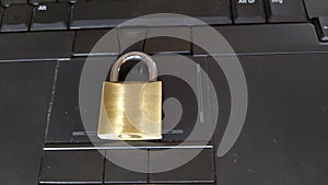 Security lock on black computer keyboard