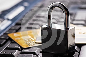 Security lock on credit cards with computer keyboard - credit card data security