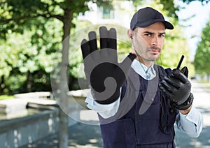 Security man outside street with trees