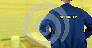 Security man on yellow background building site