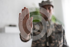 security officer making the stop sign. military