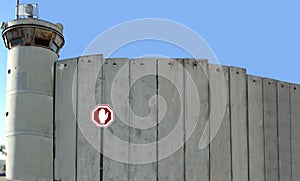 Security separation fence, concrete wall on border.