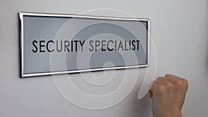 Security specialist office door, hand knocking, business protection service