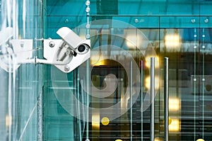 Security surveillance system at the entrance to a modern office building. Two cameras of video surveillance.