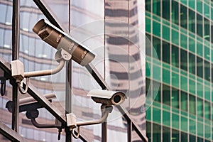 Security surveillance system at the entrance to a modern office building. Two cameras of video surveillance.