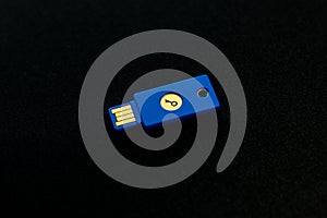 Security system concept. Key-shaped USB drive on dark background. Technology and data security theme.