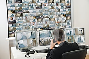 Security system operator looking at cctv footage