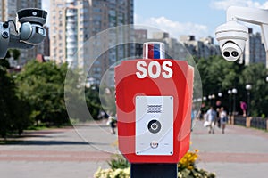 Security system in public parks. SOS, police, emergency button and security camera in a public park