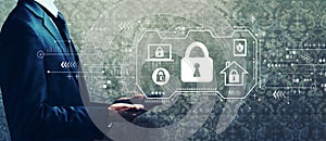 Security theme with businessman holding a tablet