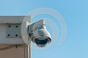 Security video control camera on sky background