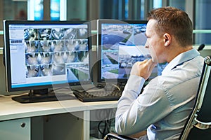 Security worker during monitoring. Video surveillance system. photo