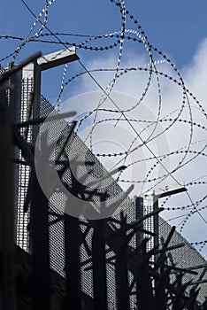 Security: Woven wire security fencing topped with razor wire. 1