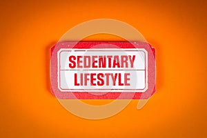 Sedentary Lifestyle. Sticky note with text on an orange background