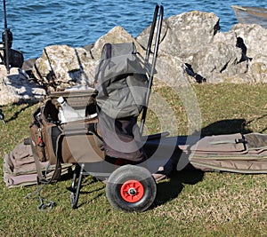sedentary sport fishing equipment with lake landscape-