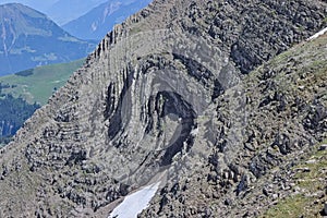 Sedimentary rock folded into syncline in alpine swiss mountains. photo