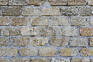 Sedimentary rock wall, fence, exterior, texture. Widely used in coastal places for build wall of house or fence, Ukraine