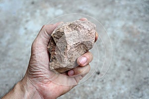 A sedimentary sandstone rock in the hand