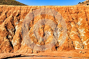 Sediments, rock formations and mineral streaks in an old abandoned quarry