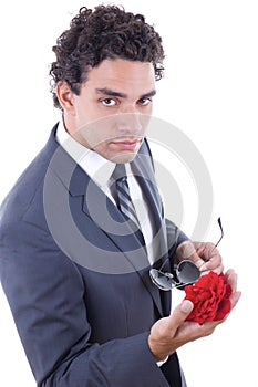 Seducer in suit holding rose