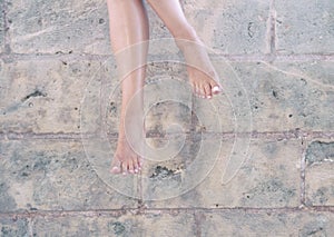 Feet woman hang wall seducing barefoot photo