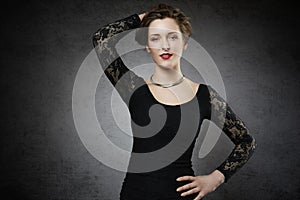 Seducing woman in black lace dress photo