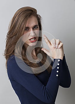 Seduction concept for enraged young woman photo