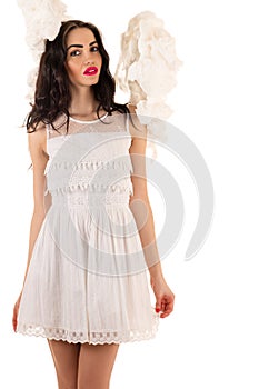 Seduction woman in white dress in the clouds