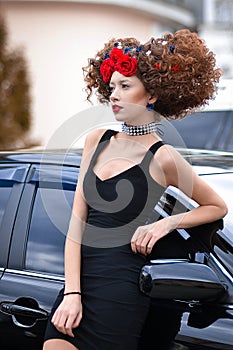 Seductive,attractive,professional,fashionable model with creative hairstyle stand outdoors