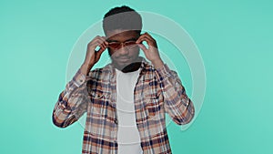 Seductive cheerful stylish african american man wearing sunglasses, charming smile on gray wall