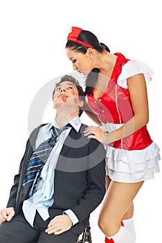 Seductive nurse with kissed businessman