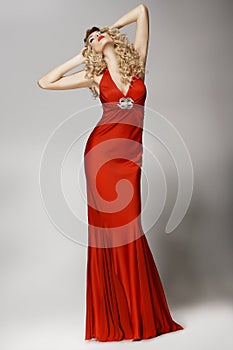 Seductive Shapely Woman in Red Dress posing