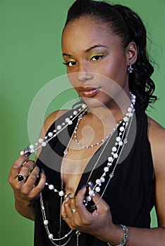 Seductive woman with beaded necklace photo