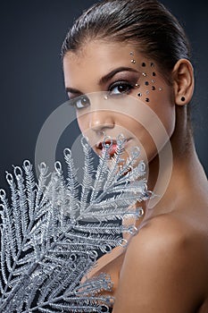 Seductive woman with silver fan