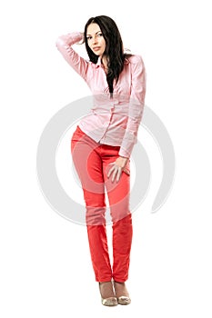 Seductive young brunette in red jeans