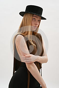 Seductive young caucasian girl wearing trendy hat