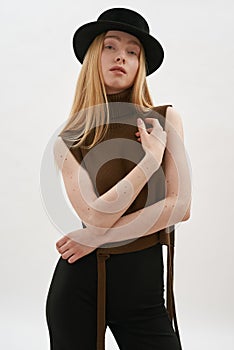 Sedusive slim young caucasian girl wearing dark hat