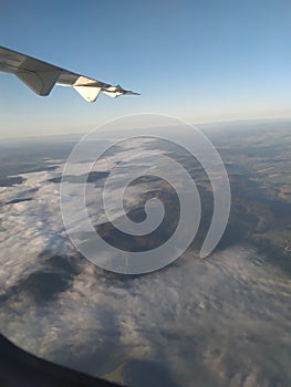 We see in flight cloud and land in the sky