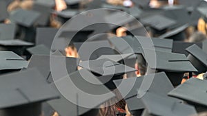 A see of graduation caps at a graduation ceremony photo