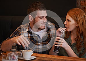 See I knew youd love this place. Cropped shot of a loving young couple on a coffee date.