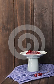 Red currants with wooden background. photo