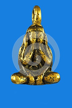 See No Evil Buddha Gold Thai Amulet on blue background.