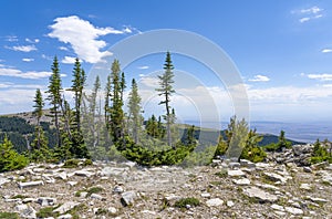 See panoramic view of Bighorn Mountain area with Montana and Wyoming plains below.