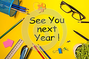 See you next year - memo at yellow office table. 2019 new year coming photo