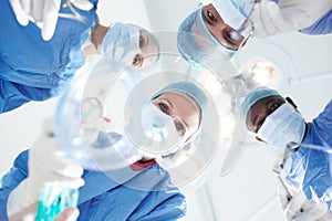 See you on the other side. Patients view of medical surgeons and doctors putting a patient under a general anaesthetic.