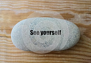 `See yourself`word on the stone - minimal design
