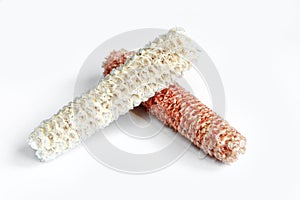 Seedless corn cobs isolated on white background.Red and white empty cornsticks