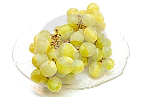 Seedless grapes in a plate isolated on white