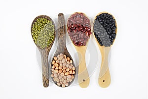 Seeds beansBlack Bean, Red Bean, Peanut and Mung Bean useful for health in wood spoons on white background