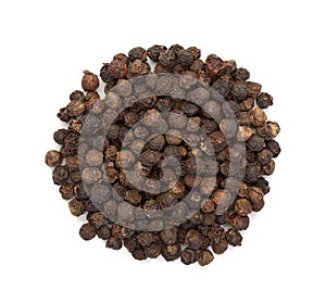 The seeds of black pepper, a heap, top view on a white background, close-up