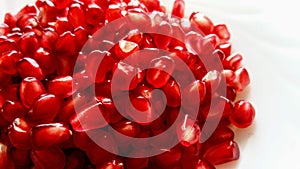 Seeds of pomegranate in a white background